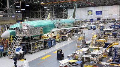 A 737 MAX plane at the Boeing plant in Renton, Washington. The company will cut more jobs on Friday. Matt Mills McKnight / Reuters