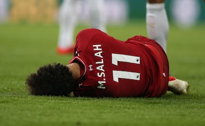 Liverpool's Mo Salah lies on the pitch after colliding with Newcastle United goalkeeper Martin Dubravka during the Premier League match between Newcastle United and Liverpool EPA