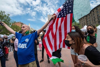 A man, who claims to have been a member of the Israeli army for 32 years, surrounded by pro-Palestinian supporters in Boston, Massachusetts, May 15. AFP