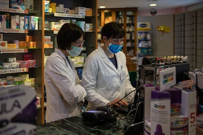 Women pharmacists at work in Milan, Italy. Getty