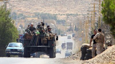 Lebanese army soldiers patrol a street in Labwe, at the entrance of the border town of Arsal, in eastern Bekaa Valley, Lebanon on July 21, 2017. Ali Hashisho / Reuters