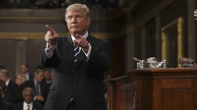 US president Donald Trump reacts after delivering his first address to a joint session of congress from the floor of the house of representatives in Washington DC. Jim Lo Scalzo / EPA