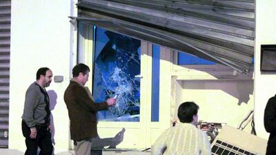 People take pictures outside the devastated prayer room in Ajaccio, on December 25, 2015, after protesters vandalized it and tried to set fire to copies of Quran, near a working-class neighbourhood of Ajaccio where two firefighters and one police officer were injured during clashes. AFP Photo