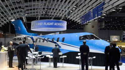 Visitors view a mockup of the Pilatus PC-24 jet at the European business aviation show. The $8.9 million business jet has completed its first flight in Switzerland and deliveries are still expected in 2017 as originally announced two years ago. Fabrice Coffrini / AFP