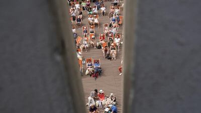 Spectators watch a match at the French Open at Roland Garros in Paris. Christophe Ena / AP Photo