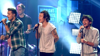 One Direction perform onstage at the One Direction iHeartRadio Album Release Party in Los Angeles. Rich Polk / Getty Images for Clear Channel / AFP