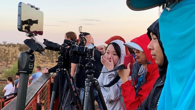 People view Uluru, formerly known as Ayers Rock, the day before a permanent ban on climbing the monolith takes effect. Reuters
