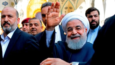 Iranian President Hassan Rouhani (C) visits in the Iraqi central city of Najaf on March 13, 2019. AFP