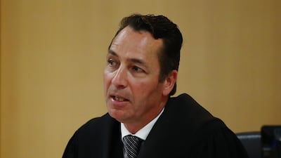 Judge Evangelos Thomas makes remarks on December 10 in Auckland, New Zealand. Getty Images