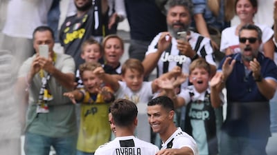 Ronaldo celebrates with Paulo Dybala. AFP