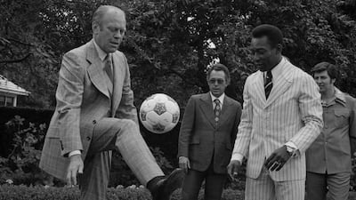 US President Gerald Ford shows off his football skills in front of Pele. Courtesy US National Archives