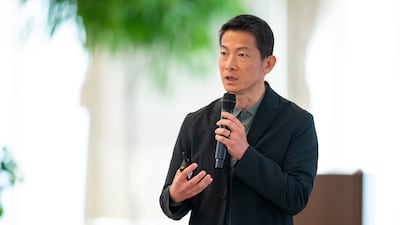 Peng Xiao, chief executive of G42 addresses an AI majlis at the Sea Palace in Abu Dhabi. Abdulla Al Bedwawi / UAE Presidential Court
