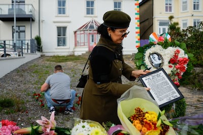 Wellwishers at the singer's former home in Bray. O'Connor's family had invited those who wish to say a “last goodbye” to stand along the seafront as the cortege passed. Reuters