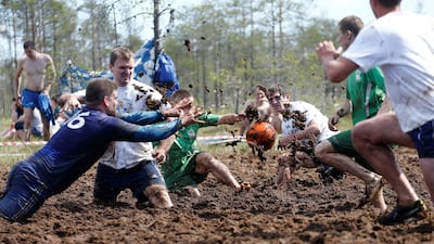 Football enthusiasts compete in the Swamp Football Cup of Russia in the village of Pogi in the Leningrad region. Anton Vaganov / Reuters