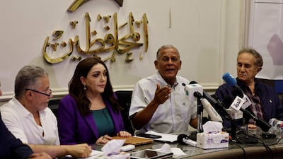 Free Current coalition leaders, from left, Akmal Kortam, Gamila Ismail, Mohamed Al Sadat and Osama Al Ghazali Harb, call for the release of activist Hisham Kassem. AFP