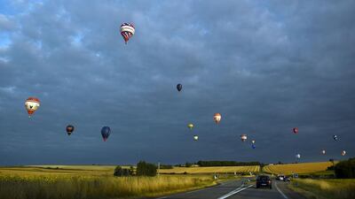 Hot-air-balloons in the air for the first race the France Ballooning Championship in Mirebeau near Chatellerault western France. Guillaume Souvant / AFP Photo