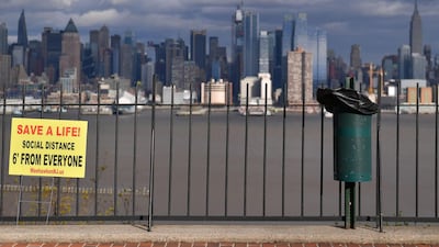 Social distance signs are posted on fences in New Jersey. Covid-19 has spread throughout the world, claiming nearly 103,000 lives, infecting about 1.7 million people and disrupting the global economy. AFP