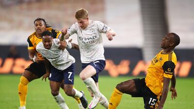 Manchester City's Kevin De Bruyne and Raheem Sterling in action with Wolverhampton Wanderers' Adama Traore and Willy Boly. Reuters