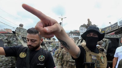Lebanese soldiers stand guard at the entrance of the Burj Barajneh Palestinian refugee camp in southern Beirut, on August 29. EPA