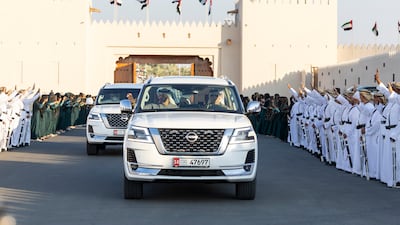 Sheikh Mohamed and Sheikh Mansour bin Zayed, Deputy Prime Minister and Minister of the Presidential Court arrive at the Sheikh Zayed Heritage Festival to attend the Union Parade. Ryan Carter / Presidential Court