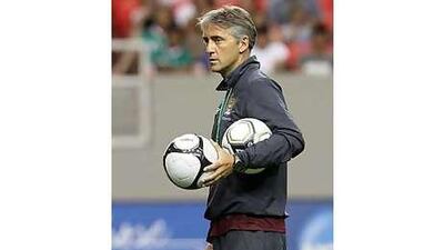 Roberto Mancini expects his summer signings to spur a Manchester City title challenge.