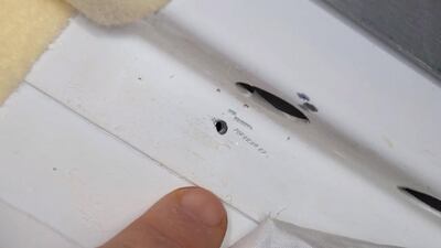 An undated handout photo made available by NASA showing a hole found in the International Space Station (ISS). NASA, HO
