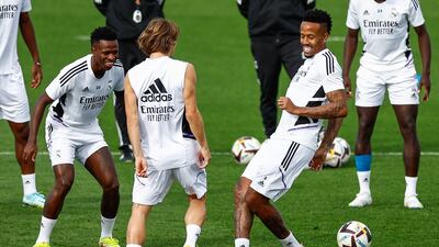 Vinicius Jr, Luka Modric and Eder Militao during training. EPA