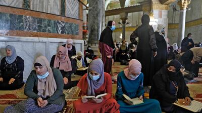 Palestinian women pray at the mosque during Ramadan last year. AFP