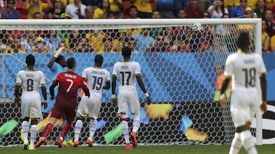 Portugal's Cristiano Ronaldo, No 7, watches as the ball sails into the net for John Boye's own goal on Thursday at the 2014 World Cup in Brasilia, Brazil. Ueslei Marcelino / Reuters