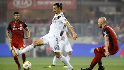 Los Angeles Galaxy forward Zlatan Ibrahimovic controls the ball against Toronto FC midfielder Michael Bradley. Canadian Press via AP