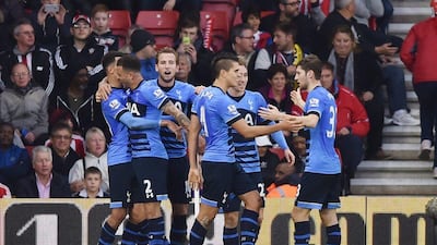 Dele Alli celebrates scoring the second goal for Tottenham with teammates in Spurs' win over Southampton on Saturday. Tony O'Brien / Action Images / Reuters / December 19, 2015