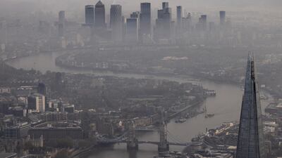 Fog shrouds the Shard and the view towards the Canary Wharf business district. Unlike the first lockdown earlier this year, schools in England will remain open. Getty Images