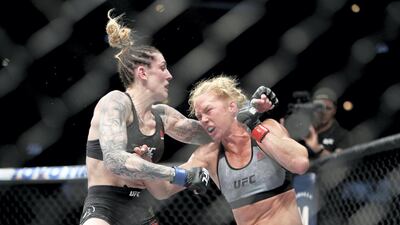 Holly Holm punches Megan Anderson in their featherweight bout during UFC 225 at the United Center in June 2018 in Chicago, Illinois. Holm won by unanimous decision. AFP