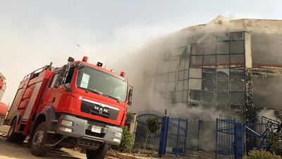 A firefighting truck is seen at the scene after a fire broke out in a garment factory north of Cairo, Egypt. Reuters