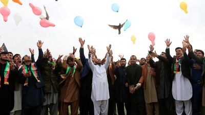 Afghan men celebrate in anticipation of the U.S-Taliban agreement to allow a U.S. troop reduction and a permanent ceasefire, in Jalalabad, Afghanistan. REUTERS