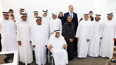 Senior Emiratis, including Ahmed Al Hashmi (fourth from right) attend the launch of the Basma programme - an Etihad benefit scheme for Emiratis aged over 60. Pawan Singh / The National