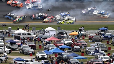 The first crash of the race after just 14 laps. AFP