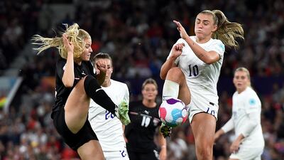 Austria's Marie Hobinger and England's Georgia Stanway compete for the ball. EPA