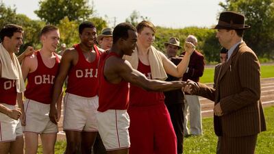Stephan James, centre, as Olympic gold medallist Jesse Owens, and Jason Sudeikis, right, as his coach Larry Snyder, in Stephen Hopkins’ Race. Thibault Grabherr / Focus Features via AP