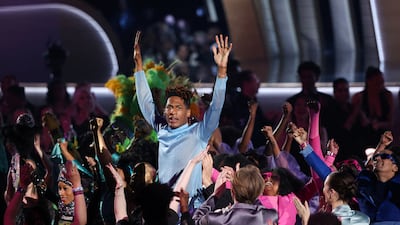 Jon Batiste performs his song 'Freedom' from the album 'We Are' during the 64th annual Grammy Awards show. Reuters