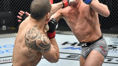 Robert Whittaker punches Darren Till. Getty