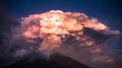 Mount Agung volcano spews hot volcanic ash into the air as seen from Kubu Village in Karangasem, Bali, Indonesia. Made Nagi / EPA