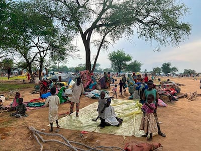 Sudanese refugees who fled the conflict in their country gather Monday July 10, 2023 at the Zabout refugee Camp in Goz Beida, Chad. AP