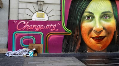 A homeless person sleeps in a street of downtown Madrid, Spain, on the eve of the International Day for Eradication Poverty. Juan Carlos Hidalgo / EPA