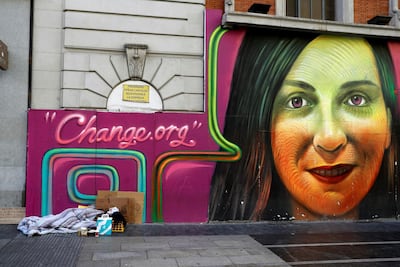 A homeless person sleeps in a street of downtown Madrid, Spain, on the eve of the International Day for Eradication Poverty. Juan Carlos Hidalgo / EPA