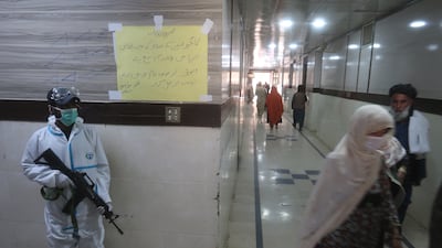 Security officials stand guard outside a ward where patients suffering from Congo virus are being treated, at a hospital in Quetta, Pakistan. EPA