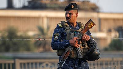 A police officer stands guard in the Iraqi capital Baghdad, where fears of another outbreak of deadly violence are mounting. AFP