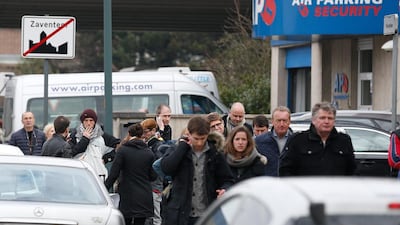 People leave the airport area after explosions at Brussels Airport in Zaventem, near Brussels, Belgium. Dozens of people have died or been injured in a double blast in the departure hall of Zaventem Airport in Brussels, Belgian media reported. Laurent Dubrule / EPA