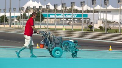 Contractors lay a total of 8,550 litres of water-based paint. The team will apply 4,500 litres of ‘Yas blue’ paint, 720 litres of ivory, 1,440 litres of red and 1,440 litres of white paint to the track ahead of the Abu Dhabi Grand Prix. Courtesy Seven Media