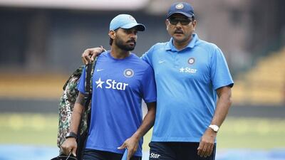 India team director Ravi Shastri, right, shown with cricketer Murali Vijay during Friday’s training session in Bangalore. Aijaz Rahi / AP